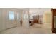 Bright foyer with tile flooring, a leaded glass front door and views to the dining room at 4420 Oak View Dr, Sarasota, FL 34232