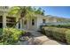 Inviting front entrance with a lush landscaped walkway and stone accents at 4420 Oak View Dr, Sarasota, FL 34232