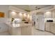 Bright kitchen with tiled floors, modern appliances, and ample countertop space for meal preparation at 4420 Oak View Dr, Sarasota, FL 34232