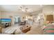 Spacious living room with open layout, tiled floors, modern furnishings, and seamless flow to the kitchen at 4420 Oak View Dr, Sarasota, FL 34232