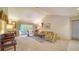 Comfortable living room with high ceilings, neutral decor, and large windows with views at 4420 Oak View Dr, Sarasota, FL 34232