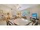 Inviting living room with large windows, tiled floors, comfortable seating, with ceiling fan and modern decor at 4420 Oak View Dr, Sarasota, FL 34232
