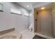 Bathroom featuring a tiled shower, toilet, and vanity sink at 4662 Long Lake Dr, Sarasota, FL 34233