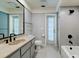Modern bathroom with stylish fixtures, neutral color palette, and updated tiling for a spa-like experience at 4662 Long Lake Dr, Sarasota, FL 34233