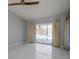Bright bedroom with tile flooring, sliding glass doors, and pool views at 4662 Long Lake Dr, Sarasota, FL 34233