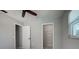 Bedroom featuring ceiling fan, closet, and window at 4662 Long Lake Dr, Sarasota, FL 34233