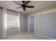 The bedroom has a ceiling fan, closet, and natural light at 4662 Long Lake Dr, Sarasota, FL 34233