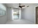Bedroom with sliding glass doors providing natural light and pool access at 4662 Long Lake Dr, Sarasota, FL 34233