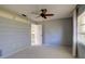 This bedroom features a ceiling fan and access to the rest of the house at 4662 Long Lake Dr, Sarasota, FL 34233