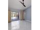 Bright bedroom featuring sliding glass doors to an outdoor pool at 4662 Long Lake Dr, Sarasota, FL 34233