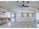 Open living room features custom built-ins, vaulted ceilings, and adjacent kitchen at 4662 Long Lake Dr, Sarasota, FL 34233