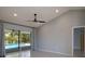 Light-filled living room with sliding glass door and views of the pool at 4662 Long Lake Dr, Sarasota, FL 34233