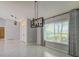 Spacious dining room with modern light fixtures and ample natural light at 4662 Long Lake Dr, Sarasota, FL 34233