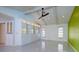 Light-filled living area featuring custom storage and large windows at 4662 Long Lake Dr, Sarasota, FL 34233