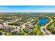 Aerial view of home in residential area with lakes and landscaping at 4706 Balboa Park Loop, Bradenton, FL 34211