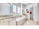Luxurious bathroom featuring a soaking tub, granite countertops, and dual sinks at 4706 Balboa Park Loop, Bradenton, FL 34211