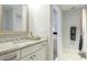 Bathroom featuring a marble countertop vanity and a glimpse into the connected bedroom at 4706 Balboa Park Loop, Bradenton, FL 34211