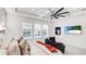 Bedroom featuring a large window, ceiling fan and comfortable lounge chair at 4706 Balboa Park Loop, Bradenton, FL 34211