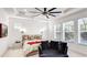 Bright bedroom features a tray ceiling, large windows and a cozy lounge chair at 4706 Balboa Park Loop, Bradenton, FL 34211