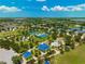 Aerial view of the community park with tennis courts, splash park, playground and pavilions at 4706 Balboa Park Loop, Bradenton, FL 34211