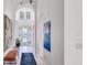 Bright foyer with high ceilings, arched doorways, and elegant double doors at 4706 Balboa Park Loop, Bradenton, FL 34211