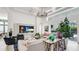 Elegant living room with stylish furniture, modern entertainment system, and seamless access to the outdoor patio and pool area at 4706 Balboa Park Loop, Bradenton, FL 34211