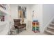 Sitting area with open shelving, neutral colors, colorful storage bins, and a reading area at 4706 Balboa Park Loop, Bradenton, FL 34211