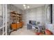 Modern office design with unique desk, custom shelves and textured wallpaper at 4706 Balboa Park Loop, Bradenton, FL 34211