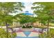 Community park and seating area offering a gathering spot for residents surrounded by landscaped greenery at 4706 Balboa Park Loop, Bradenton, FL 34211