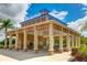 Community pavilion with picnic tables provides a gathering spot for events and relaxation near lush landscaping at 4706 Balboa Park Loop, Bradenton, FL 34211