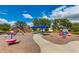 Community playground with colorful equipment, ample seating, and shady spots for enjoyment at 4706 Balboa Park Loop, Bradenton, FL 34211