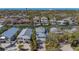 Aerial view of a waterfront property with a metal roof near canals and other residences at 4922 Commonwealth Dr, Sarasota, FL 34242