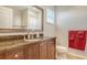 Bathroom with granite countertops, a large mirror, and a walk-in shower at 4922 Commonwealth Dr, Sarasota, FL 34242