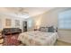 Bedroom with a queen-sized bed, neutral walls, and bright, natural lighting at 4922 Commonwealth Dr, Sarasota, FL 34242