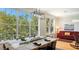 Bright dining room featuring large windows with views and modern light fixtures at 4922 Commonwealth Dr, Sarasota, FL 34242