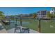 Waterfront living with a boat dock and a relaxing view of the canal and neighboring homes at 4922 Commonwealth Dr, Sarasota, FL 34242