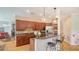 Gourmet kitchen with granite countertops, stainless steel appliances, and breakfast bar at 4922 Commonwealth Dr, Sarasota, FL 34242