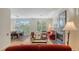 Bright living room with a cozy fireplace, hardwood floors, and comfortable seating area at 4922 Commonwealth Dr, Sarasota, FL 34242