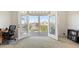 Bright office with french doors that open to a balcony with views of the water at 4922 Commonwealth Dr, Sarasota, FL 34242
