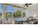 Relaxing screened-in patio with a view of the pool and waterway at 4922 Commonwealth Dr, Sarasota, FL 34242