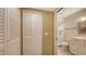 Bathroom with bright white walls, a large mirror, and an enclosed shower at 5078 Marsh Field Rd # 82, Sarasota, FL 34235