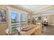 Bright dining area with sliding doors offering views of the scenic outdoors at 5078 Marsh Field Rd # 82, Sarasota, FL 34235