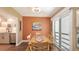 Cozy dining room with wooden table, chairs and adjacent modern kitchen at 5078 Marsh Field Rd # 82, Sarasota, FL 34235