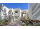 Inviting condo featuring a neatly landscaped entrance and a brick staircase leading to the front door at 5078 Marsh Field Rd # 82, Sarasota, FL 34235