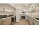 Bright kitchen with stainless steel appliances, white cabinets, and a washer and dryer for convenience at 5078 Marsh Field Rd # 82, Sarasota, FL 34235