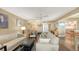 Comfortable living room featuring a sofa, loveseat and views of the dining area at 5078 Marsh Field Rd # 82, Sarasota, FL 34235