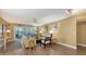 Spacious living room with neutral walls, recessed lights, and laminate floors overlooking the screened in lanai at 5078 Marsh Field Rd # 82, Sarasota, FL 34235