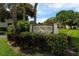 Community sign 'Heronmere' surrounded by lush landscaping and trees at 5078 Marsh Field Rd # 82, Sarasota, FL 34235
