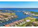 Stunning aerial view of a waterfront community with lush landscaping, private docks, and scenic waterways at 510 16Th E Ave, Palmetto, FL 34221