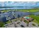 Aerial view of a community with a marina, pool, boat parking, and clubhouse, offering comprehensive waterfront amenities at 510 16Th E Ave, Palmetto, FL 34221